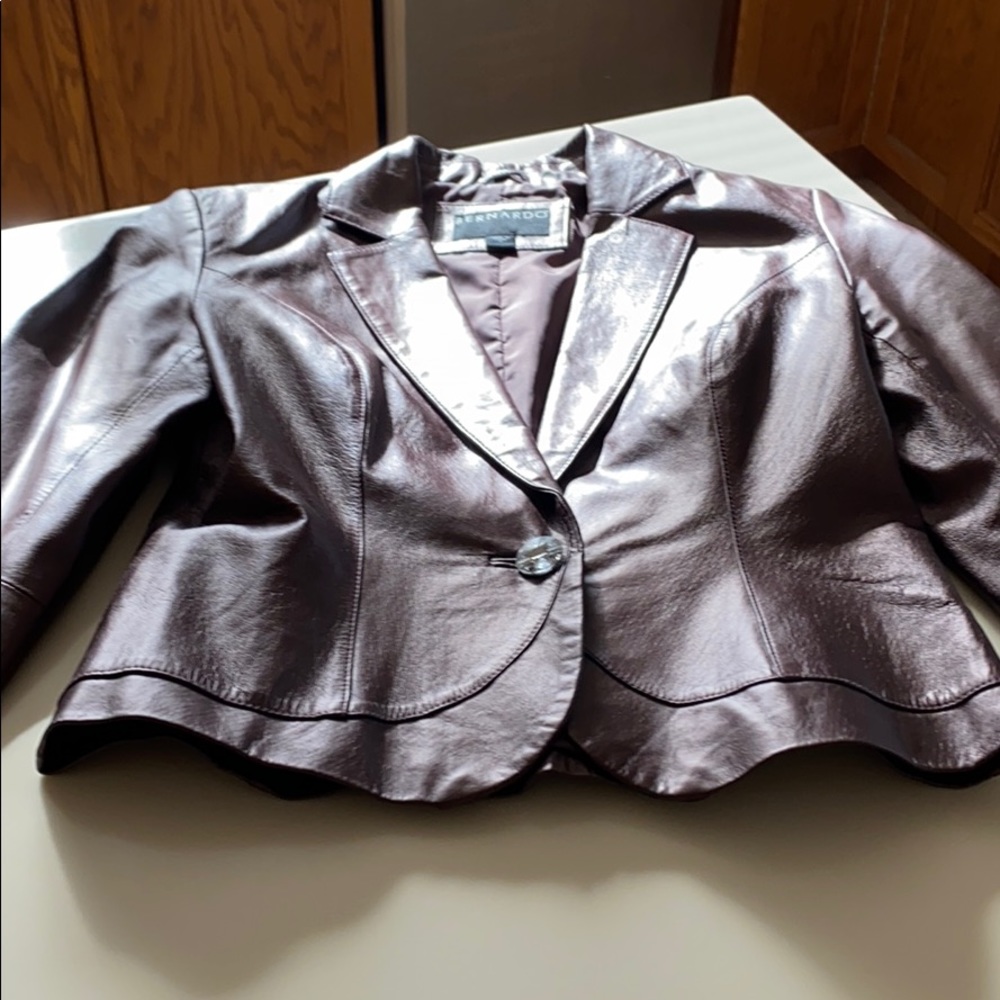 Single button metallic purple leather jacket.